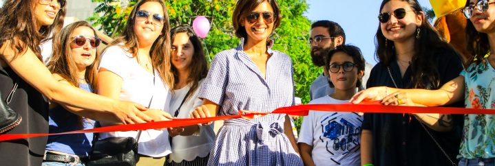 Raya Raphael Nahas and ALBA students cutting the ribbon during the fence inauguration of Banque Libano-Française new headquarters site